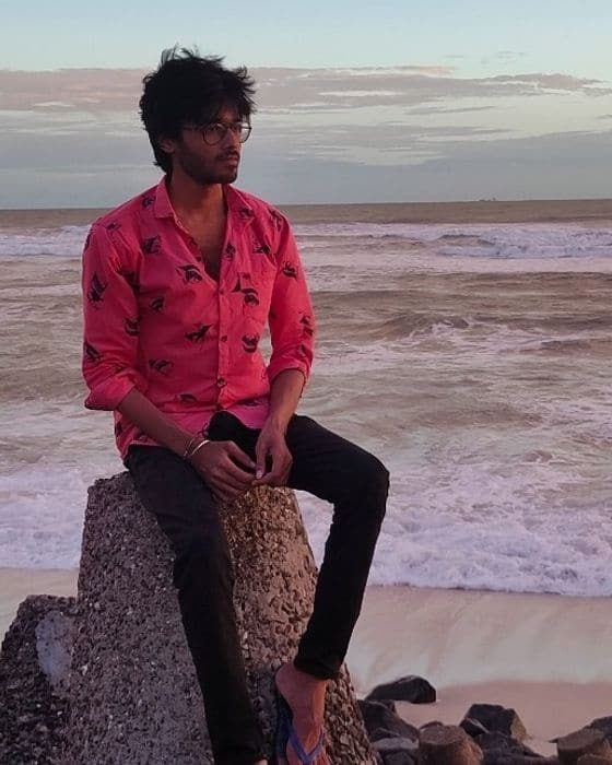 Tejas Parmar by the sea at sunset